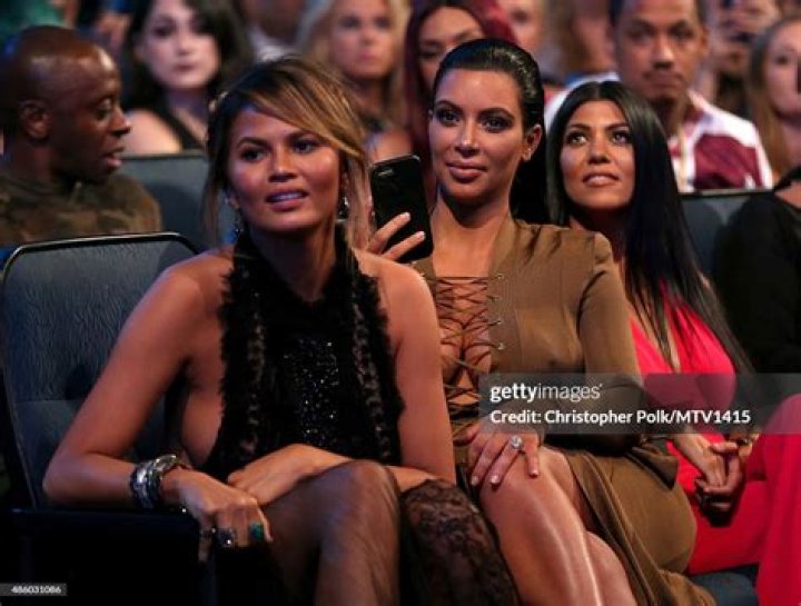 15 Celebs Rocking Sexy Plunging One-Pieces: Kourtney Kardashian, Chrissy Teigen & More