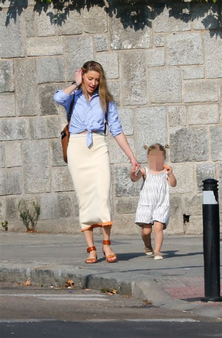 Amber Heard Walks With a Cane in Rare Photos with Daughter Oonaugh Paige, 2, in Spain