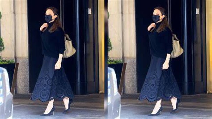 Angelina Jolie Rocks Black Turtleneck & Matching Skirt At LAX After Meeting With U.S. Gymnasts