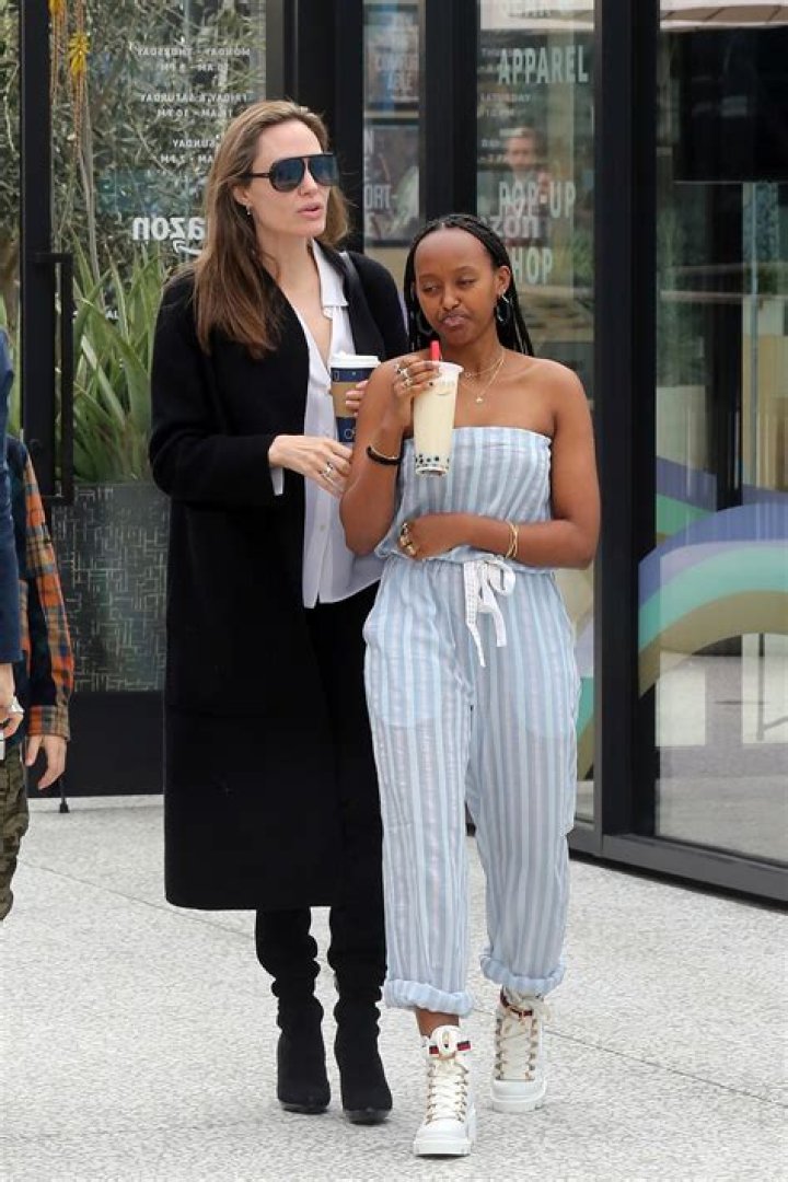Angelina Jolie’s All Smiles In White Flowy Dress During Shopping Trip With Kids Zahara, Knox & Vivienne 