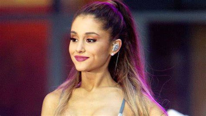 Ariana Grande Channels Barbarella In Sexy Sheer Bodysuit & Silver Skirt To Promote New Beauty Brand