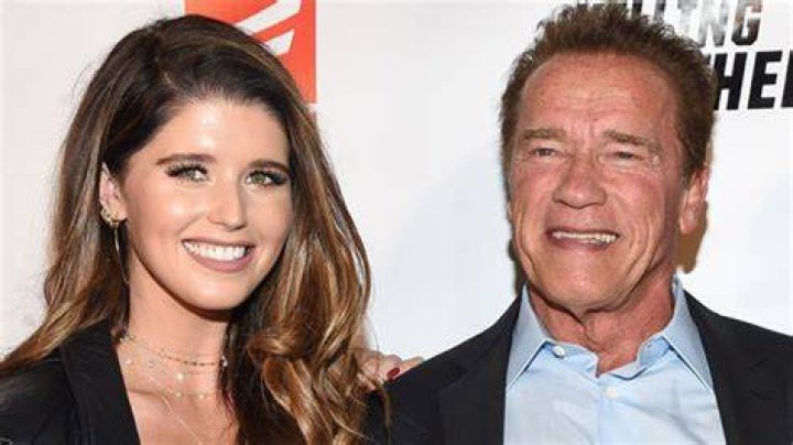 Arnold Schwarzenegger Kisses Granddaughter Eloise, 6 Months, In Sweet Baptism Photo
