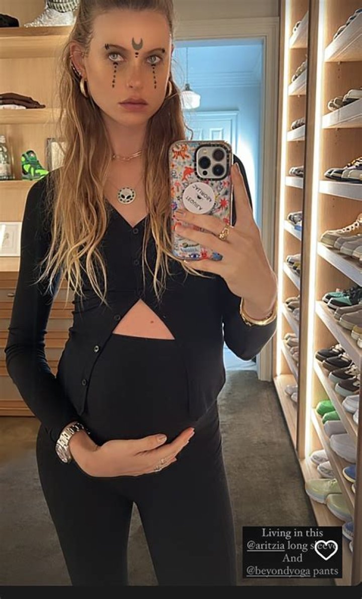 Behati Prinsloo Shows Off Baby Bump In Tight Black Dress After Standing By Adam Levine: Photo