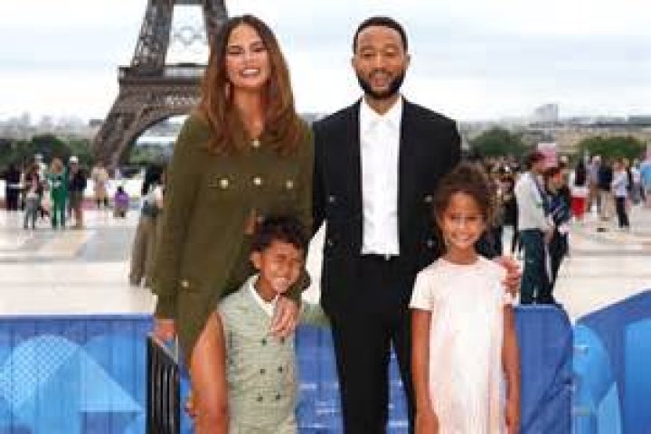 Chrissy Teigen, 35, Slays In Plunging Purple Swimsuit On Vacation With John Legend & Kids
