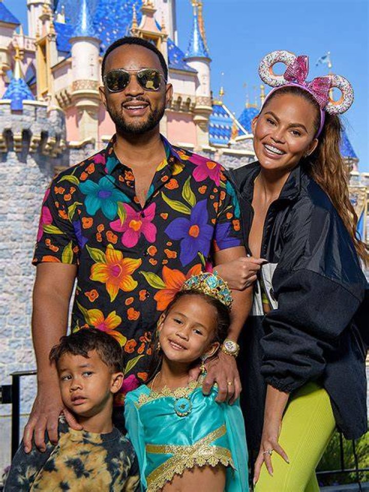 Chrissy Teigen Looks Amazing In Neon Pink Swimsuit On Vacation With John Legend & Kids