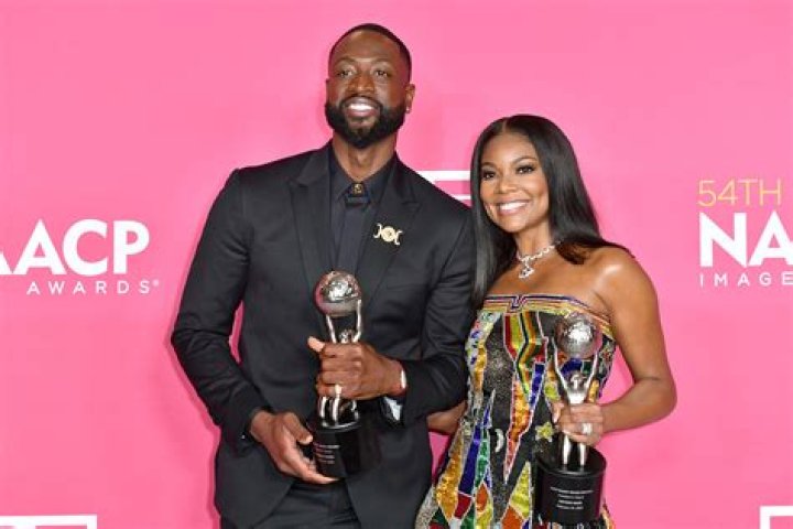 Gabrielle Union & Dwyane Wade Share A Sweet Kiss After Leaving Barack Obama’s 60th Birthday Bash — Photo