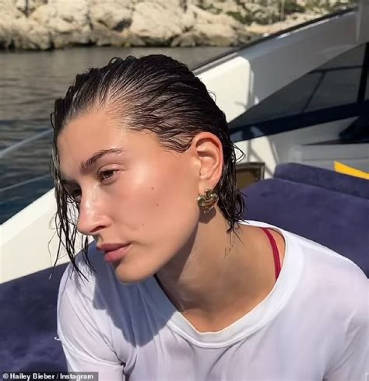Hailey Bieber Rocks Red Bikini Bottoms & Wet ‘Got Milk?’ T-Shirt For Sexy Summer Boat Ride: Photos
