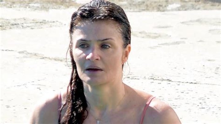 Helena Christensen, 53, Rocks Majorly Plunging Black Swimsuit To End 2021 — Photo