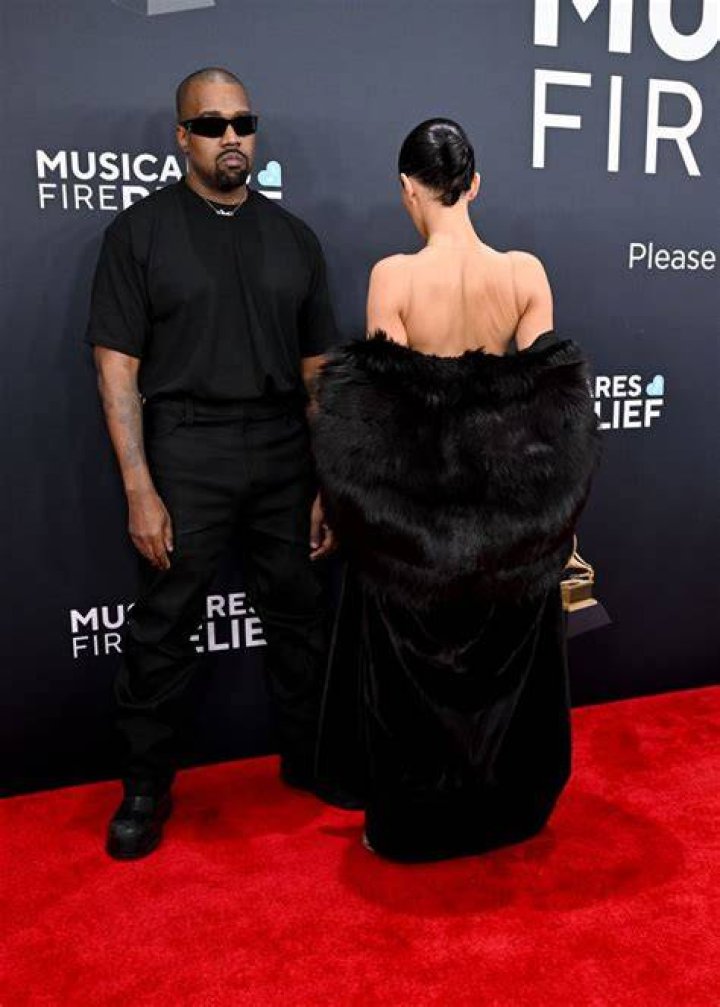 Kanye West & Wife Bianca Censori Hold Hands as She Shows Her Partial Lower Backside in Neon Leggings