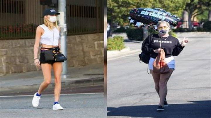 Kesha Sports White Daisy Dukes & A ‘Playboy’ Sweatshirt As She Flashes A Peace Sign — Photos