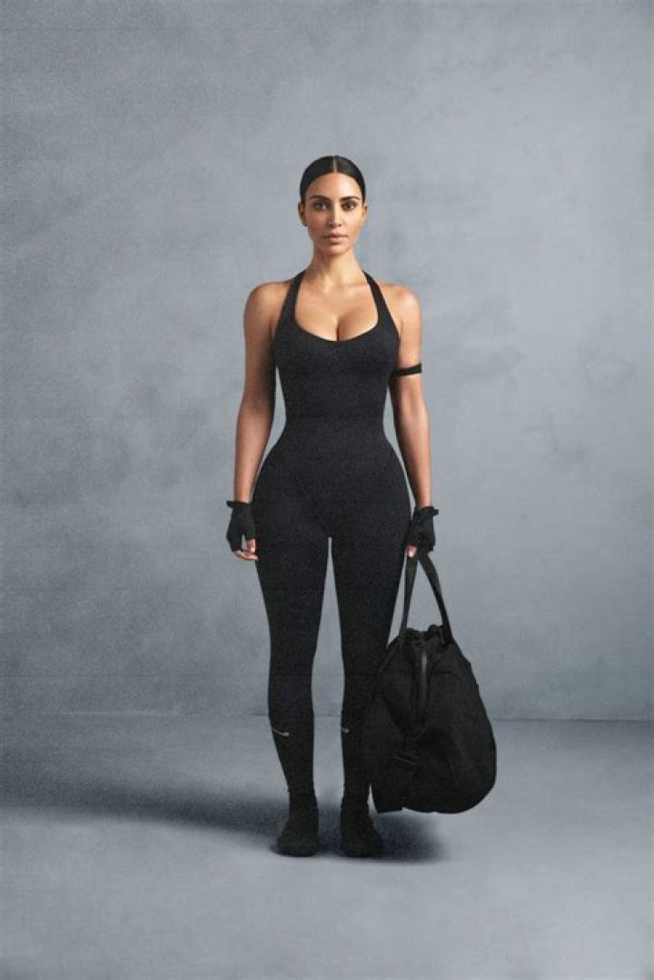 Khloe Kardashian Flaunts Cleavage & Curves In Lacy Bodysuit For Denim Line Launch — Pics