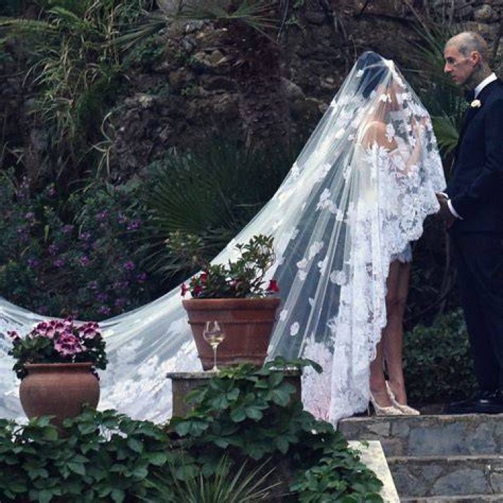 Khloe Kardashian Sizzles In Strapless Mini Dress & Lace Up Boots For Lunch Before Kourtney’s Wedding: Photo