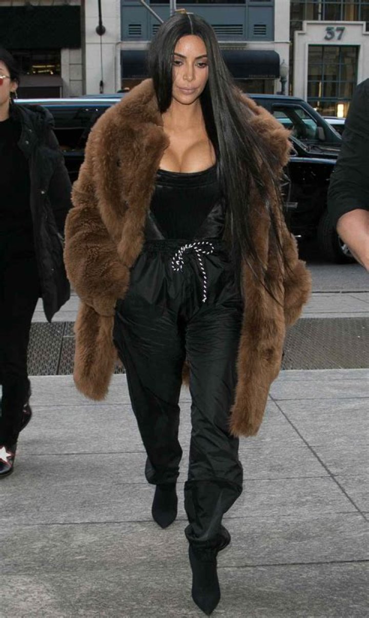 Kim Kardashian Rocks Crop Top & High Waisted Pants While Showing Off New KKW Lip Glosses