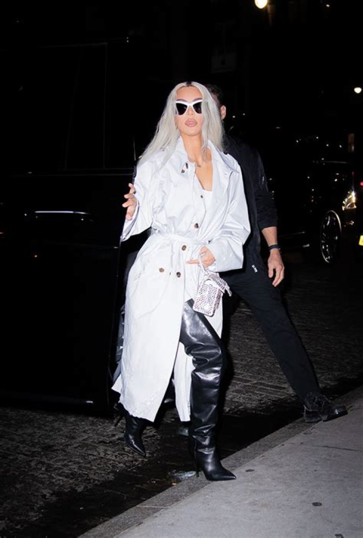 Kim Kardashian Rocks Thigh-High Leather Boots With Bodysuit & Trench Coat For Night Out In NYC