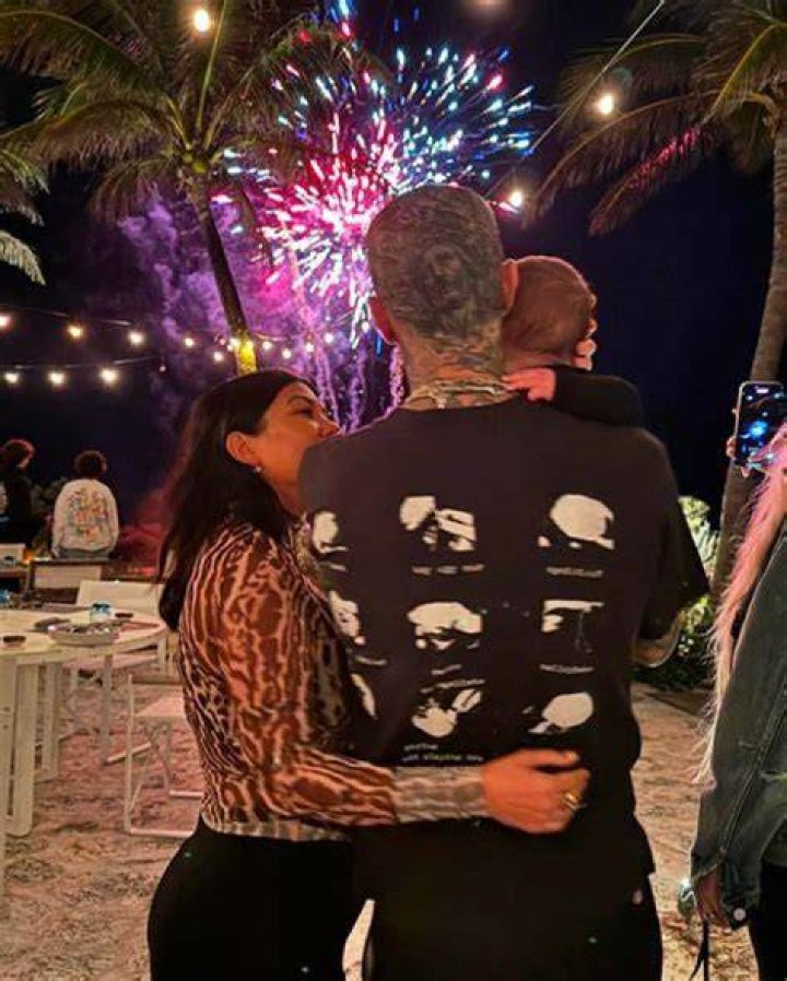 Kourtney Kardashian Rocks Sheer White Shirt & Holds Hands With Travis Barker On Honeymoon