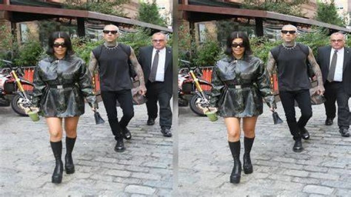 Kourtney Kardashian Steps Out With Travis Barker In Snakeskin Mini Coat & Boots After ‘SNL’ Spoof