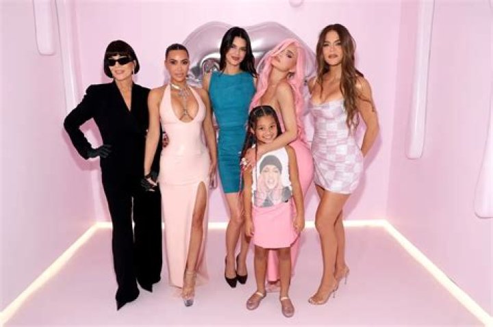 Kylie Jenner, Kim Kardashian, & All The Sisters Reunite For ‘Spice Girls’ Family Pic Crashed By Saint