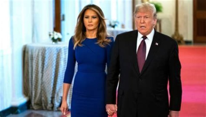 Melania Trump Looks Terrified Holding Hands With Donald Trump While Wearing $1,140 Blue Dress — Pic