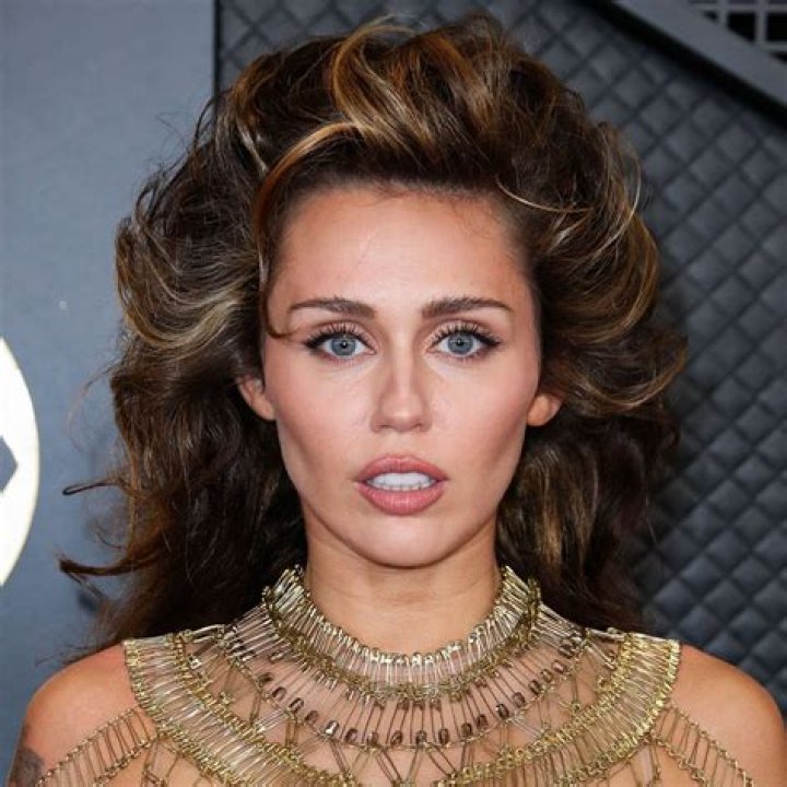 Miley Cyrus Poses Topless In Just Her Tights For Golden Lady Campaign – Hollywood Life