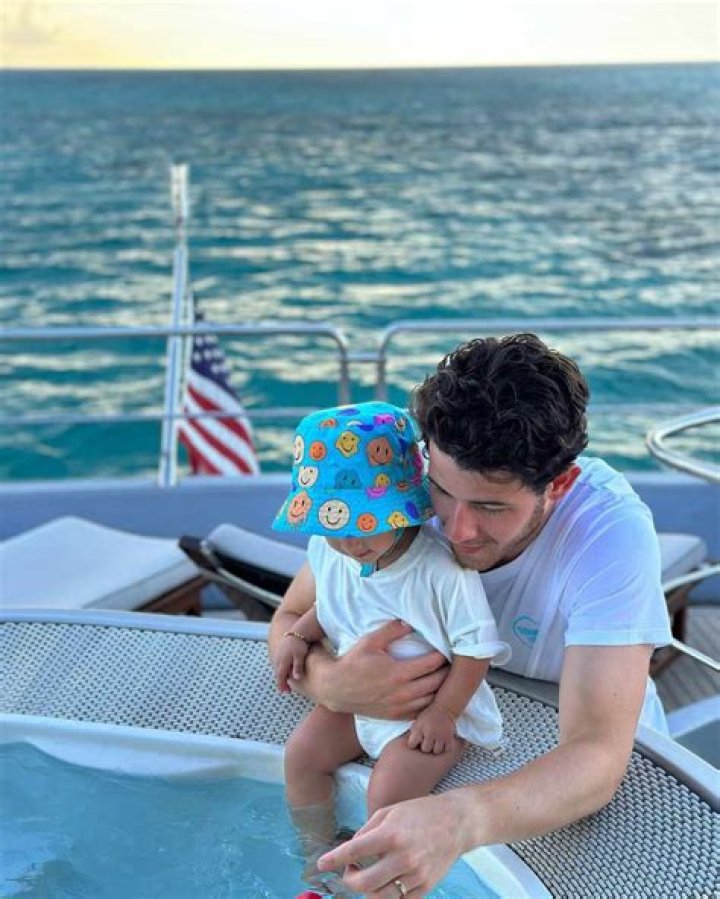 Nick Jonas Hugs Daughter Malti, 2, During Theme Park Trip: See Adorable Photos
