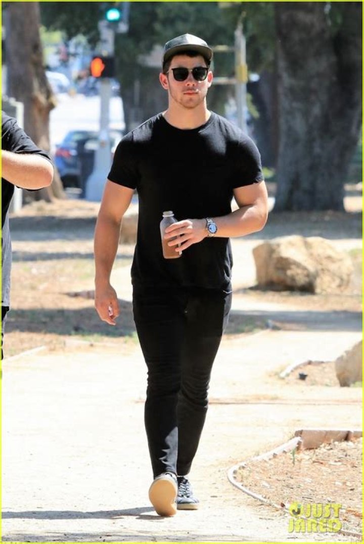 Nick Jonas Looks Incredibly Buff While Lifting Dumbbells In A Tank Top & Gym Shorts — Watch