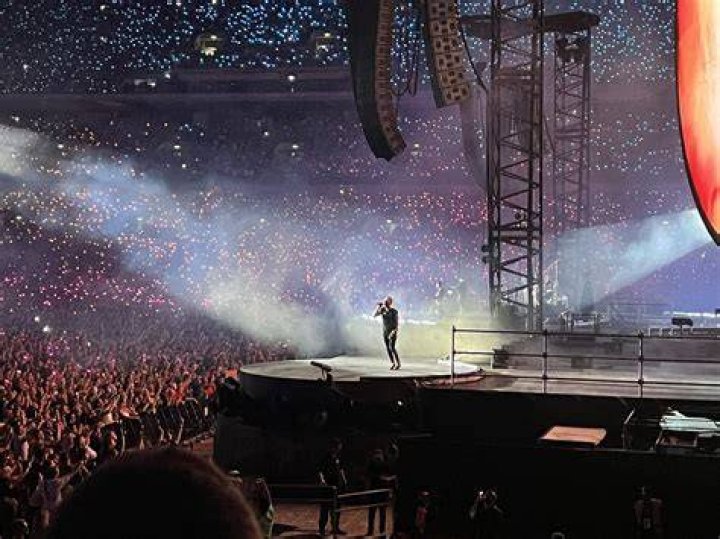 Olivia Newton-John Honored By Coldplay With Gorgeous ‘Summer Night’s Rendition On Tour