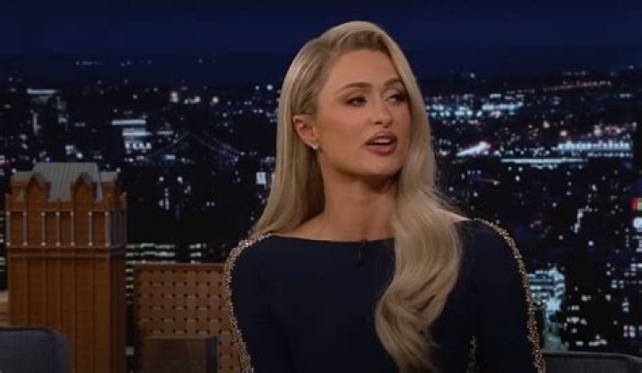 Paris Hilton Sparkles In Plunging Silver Mirror Dress To Present At The AMAs — See Her Look