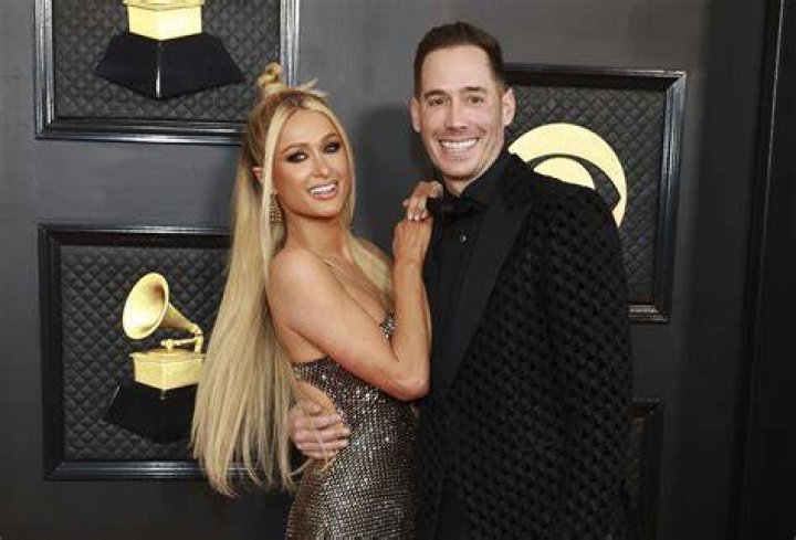 Paris Hilton Trolled For Wearing A Diamond, Mesh Face Covering On Date Night With BF Carter Reum — See Pic