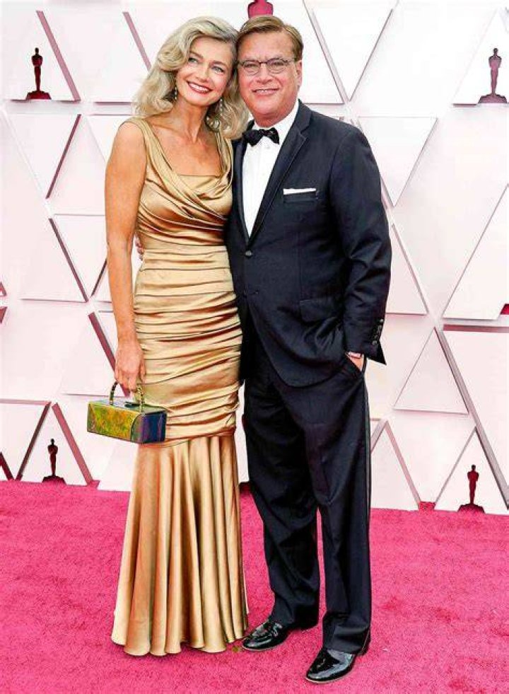 Paulina Porizkova, 56, Wows In Gold Gown Cuddling Up To Aaron Sorkin At the Oscars