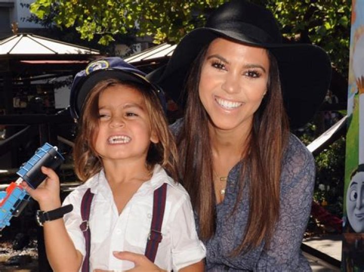 Penelope Disick, 8, Is So Cute Carrying Her Puppy In Cozy Robe Hood — See Pic