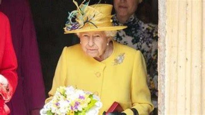 Queen Elizabeth Looks Ready For Easter In Yellow Hat With Feathers & Matching Coat — Pics