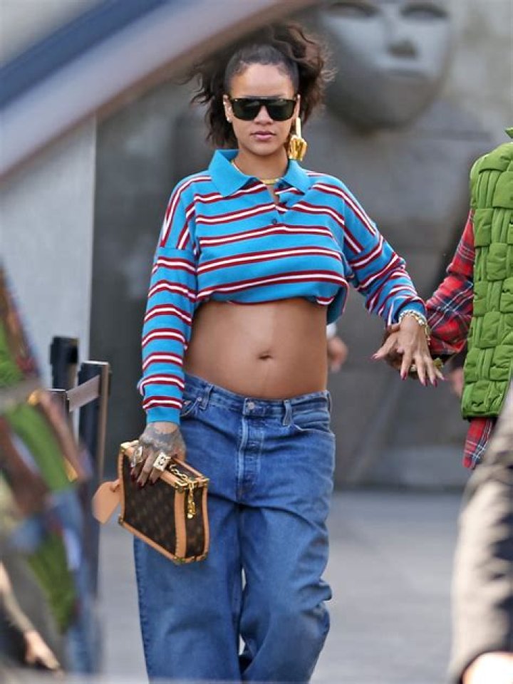 Rihanna Bares Her Baby Bump In Tiny Pink Crop Top & Low-Rise Ripped Jeans: Photos
