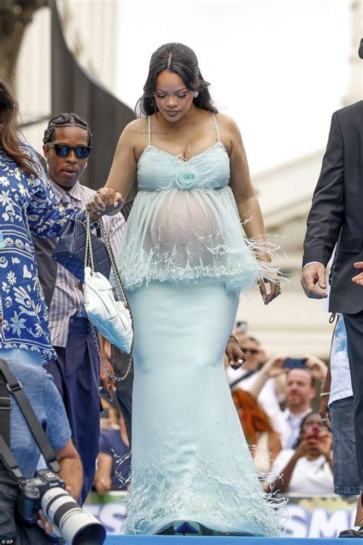 Rihanna Dresses Up Her Baby Bump With Body Jewelry As She Reveals Bare Belly In Open Coat