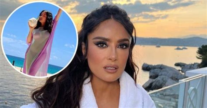 Salma Hayek, 55, Lets Waves Crash Over Her As She Hits The Beach In Blue Swimsuit