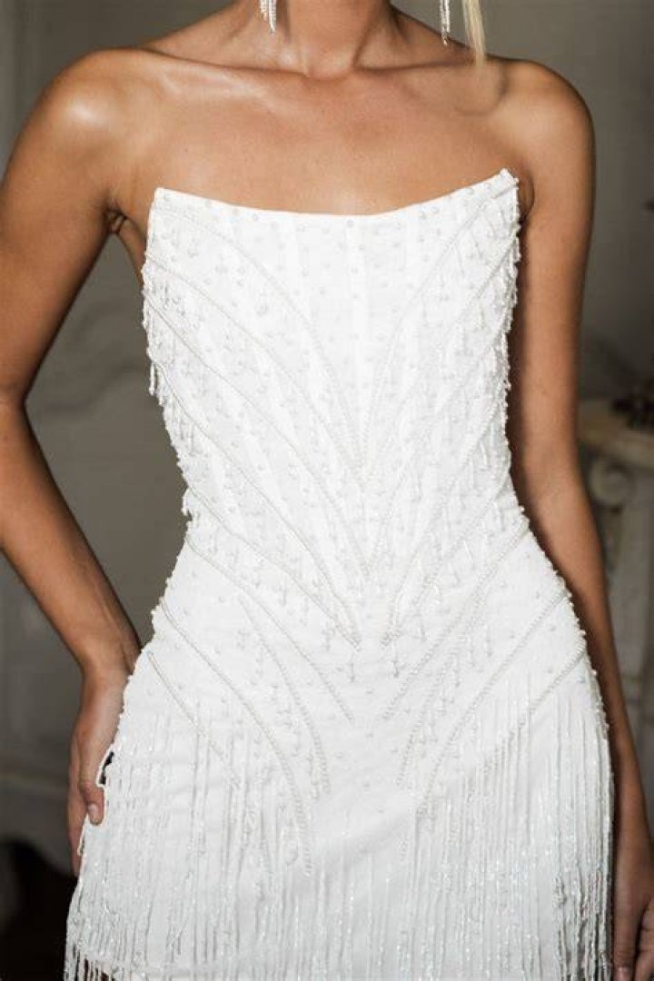 See Her White Beaded Dress – Hollywood Life