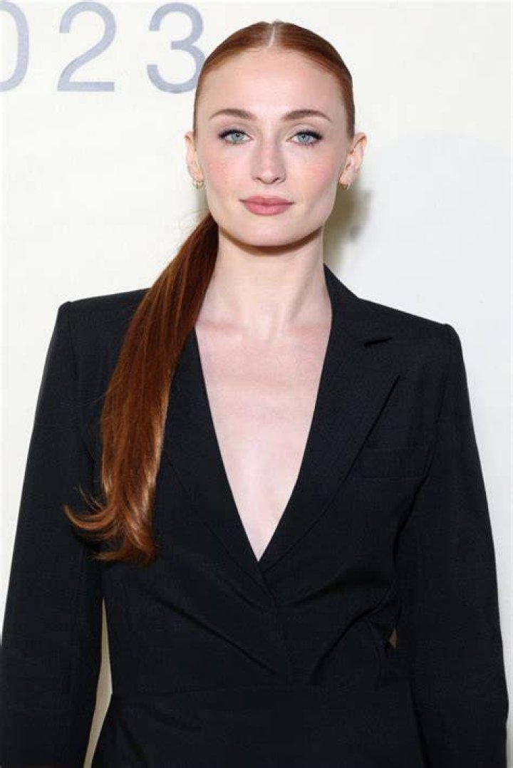 Sophie Turner Looks Angelic As She Shows Off Her Baby Bump In All White Mini Dress  