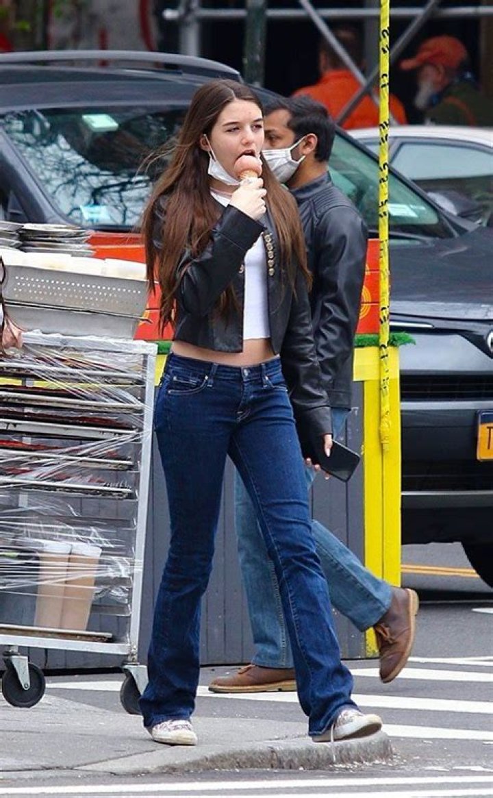 Suri Cruise Sports Long Hair While Posing With Flowers & Goofing Off With Friends On 15th Birthday