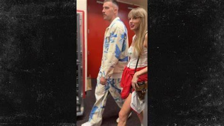 Taylor Swift Wraps Her Arm Around Travis Kelce in First PDA Photo – Hollywood Life